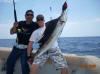 Chase holding Mic's sailfish.